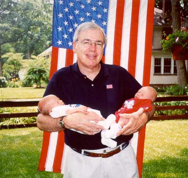 Henry with 3 week old twin grandsons